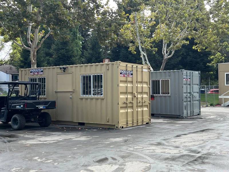 A group of small containers parked in a lot in Monterey County, CA